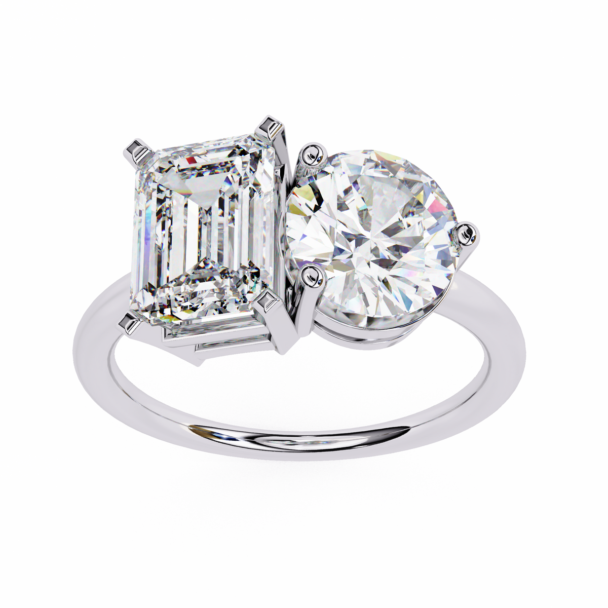 Diamond ring with two prominent gemstones on a white background